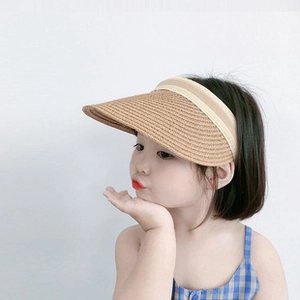 Detail of children's khaki straw open-top sun hat showing natural woven texture