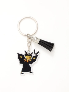 Detail of cartoon vampire girl acrylic keychain with black tassel and silver metal ring