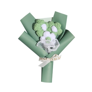 Handmade crochet puff flower bouquet in green wrapping with a white Love Is Eternal ribbon