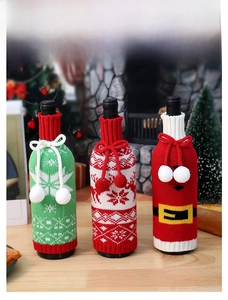 Three-piece knitted Christmas wine bottle covers with reindeer and snowflake patterns