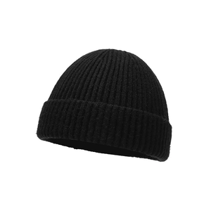 Classic black knitted skull cap with vertical ribbed texture on a white background