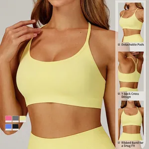 Seamless yellow sports bra with Y-back design and ribbed hem for fitness and running