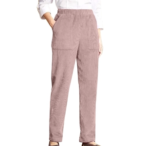 Close-up of pink corduroy pants showing elastic waistband and side pocket detail