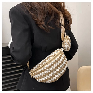 Detail of woven straw crossbody bag with chevron pattern and small matching coin purse