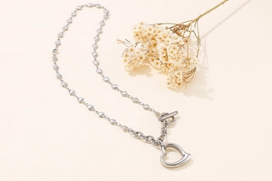 Silver stainless steel heart chain necklace with a T-bar toggle clasp and hollow heart pendant