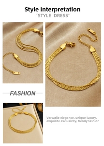Close-up of gold plated multi-strand woven stainless steel chain with lobster clasp
