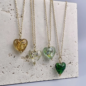 French retro heart glass pendants with gold foil in amber and green on gold chains