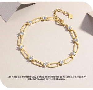 Detailed macro view of S925 sterling silver paperclip chain bracelet with zircon stones