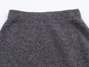 Detailed macro view of dark grey knit fabric texture and premium fleece material