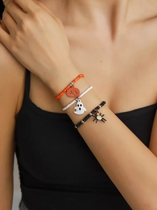 Halloween beaded bracelet set featuring orange pumpkin, white ghost and black spider charms