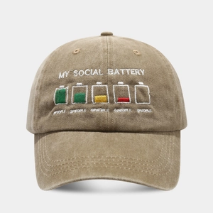 Close-up of MY SOCIAL BATTERY embroidery on a vintage washed cotton baseball cap