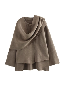 Detail of dark brown knit cardigan with asymmetrical scarf collar and wool-like texture