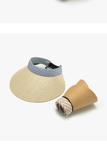 Foldable women's straw sun visor hat showing both expanded and rolled-up portable state