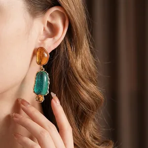 Vintage oval resin earrings in amber and emerald green with gold-plated metal borders