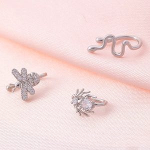 Detailed shot of silver U-shaped ear cuffs with zircon bee and spider animal designs
