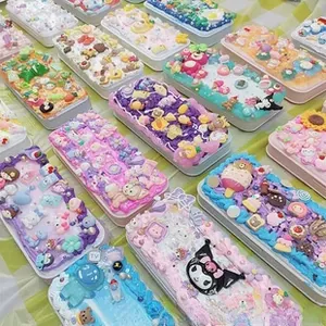 Close-up of DIY cream glue stationery boxes with Kuromi and Melody resin charms