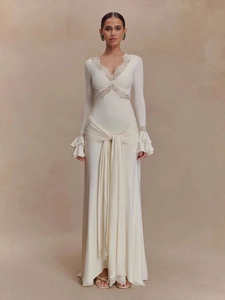 Elegant cream V-neck maxi dress with lace detailing and layered ruffle bell sleeves