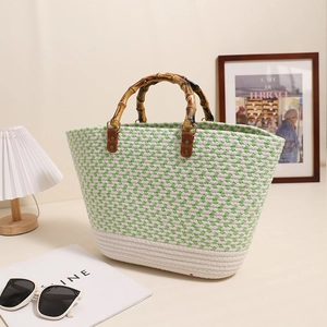 Green and white chevron woven cotton handbag with elegant bamboo handles and leather straps