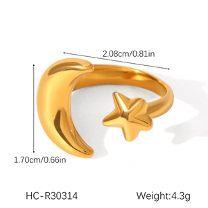 Detail shot of gold star and moon ring showing dimensions 2.08cm width and 1.70cm height
