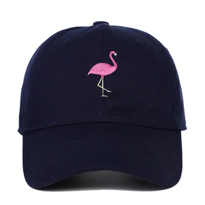 Close-up of pink flamingo embroidery on navy blue cotton twill baseball cap