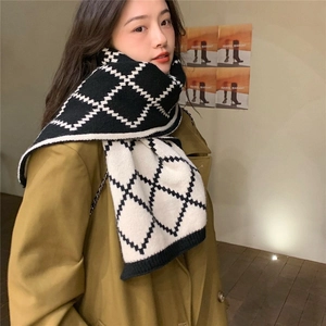 Classic black and white checkered knit scarf with reversible geometric rhombus pattern