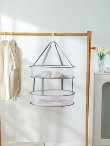 Detail of grey double-layer drying net with windproof hook for delicate sweaters