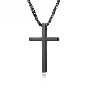 Close-up of a minimalist matte black stainless steel cross pendant necklace on white background