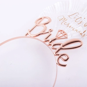 Close-up of rose gold bride headband with diamond icon for bachelorette party