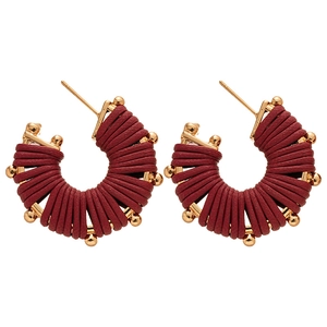 Vintage gold U-shaped hoop earrings with dark red leather wrapping and bead accents