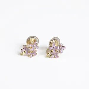 Floral clip-on earrings with purple enamel flowers and green leaves on gold plating