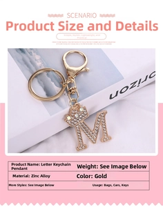 Macro detail of gold letter M keychain with crystal rhinestones and crown decoration