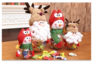 Detail of Christmas candy jars with plush characters in large and small sizes