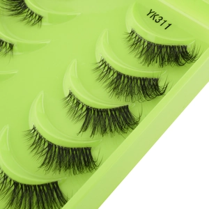 Detail view of 10 pairs of YK311 natural false eyelashes on a green tray
