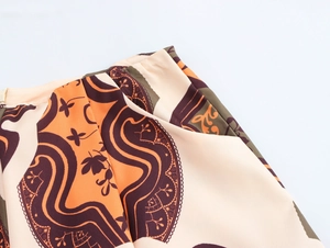 Detail view of high-waist Bohemian geometric print shorts with seamless stitching