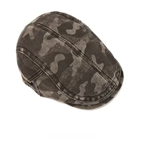 Close-up of the washed camouflage pattern and textured canvas fabric of the vintage hat