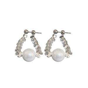 Silver metallic geometric earrings with large white pearls on a clean white background
