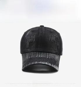 Detailed view of the distressed vintage denim texture and ripped edges on the baseball cap