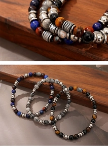 Detailed view of 7mm tiger eye and map stone beaded bracelets with vintage metal accents