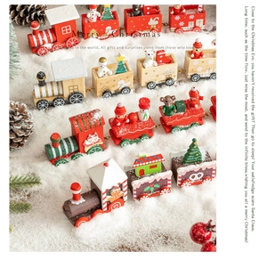 Macro view of multi-color wooden Christmas train ornament with snow scene and pine cones