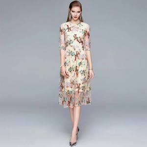 Elegant off-white embroidery dress with colorful floral patterns and mesh detailing