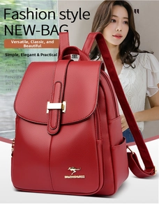 Detail of burgundy leather backpack featuring gold kangaroo logo and flap closure