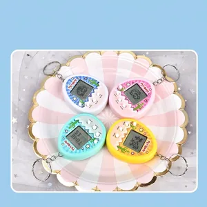 Mini virtual electronic pet game console keychains in pink, white, blue, and yellow colors
