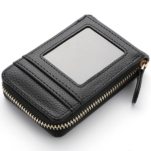 Black pebbled leather accordion card holder with gold zipper and transparent ID window