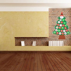 Felt Christmas tree countdown calendar with 24 numbered ornaments on red brick wall