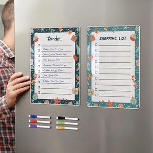 Detailed view of magnetic acrylic weekly planners with colorful dry erase pens on a fridge