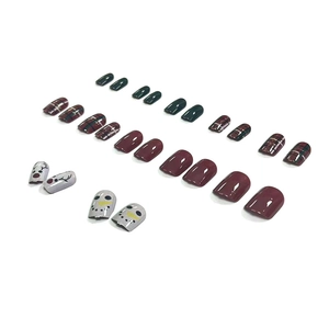 Christmas press-on nails with green and red plaid patterns, reindeer and snowman designs