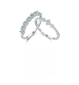 Detailed macro view of S925 sterling silver rings with mint blue and clear zircon stones