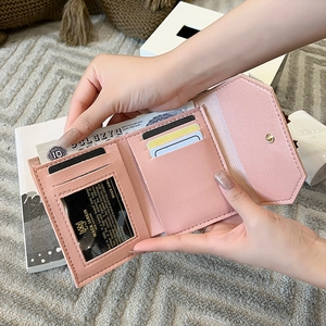 Pale pink minimalist trifold small purse with multiple card slots and banknote pocket