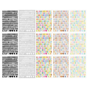 Macro view of multi-color alphabet and number sticker sheets for DIY scrapbooking