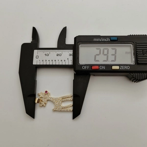 Golden reindeer pendant with zircon inlay measured at 29.3 mm with digital calipers